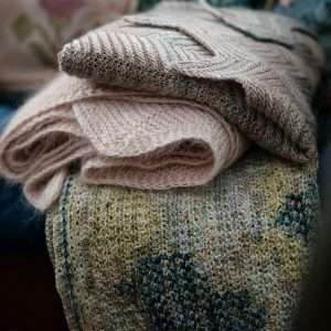 52 Weeks of Shawls | stack of knitwear