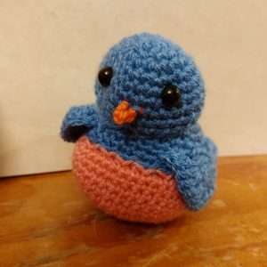Crocheted bird with black dome safety eyes
